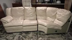 Partial leather sectional is in fair/good condition. Normal wear from sitting. Has stains: 2 small on top of cushion...