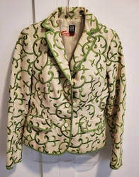 I have this gorgeous blazer. It is heavy duty linen fabric. The green is embroidered. The inside lining is yellowed...