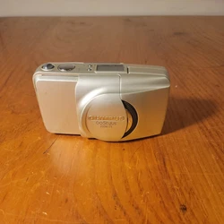 Olympus Infinity Stylus Zoom 115 Point Shoot Film Camera 35mm - For Parts. Powers on but automatic wind is broken....