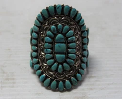 JW initials engraved (unsure as to who the creator is, but quality piece). Floral design with turquoise. Bangle/cuff...