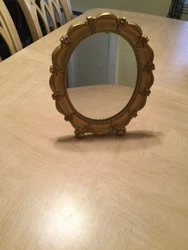 This is a preowned vintage table/ wall mirror that’s in very good overall condition. It measures about 13 inches long...