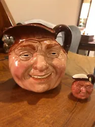 These Royal Doulton collectible character jugs, titled 