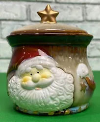 Add some festive cheer to your holiday decor with this beautiful Greenbrier hand-painted Santa and stars candy jar....