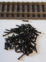 Lot de 100 vis noire de  fixations rails HO N et fixations d accessoires  Fleischmann Roco Jouef Marklin Trix........