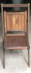 Nice antique solid chair. It can hold an adult with no issues. It folds well and is level when sitting on it . It says...