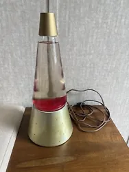 This vintage 1970s Lava Lamp is a unique piece that will add a touch of retro style to any space. With a gold Starlite...
