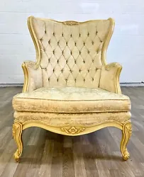 This is a stunning vintage tufted French Provincial Louis XV Rococo Baroque wingback arm chair or Bergere. Features...
