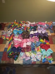 Over 40 jojo bows some new some used. Also includes 2 jojo bow holders.