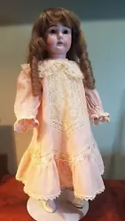 I believe the clothing is original to the doll. The clothing seems very well made - see photos. She has beautiful white...