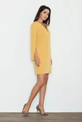 Elegant dress with a simple cut, fastened with a covered zipper, V-neckline. The dress has sleeves with original slits....