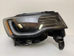 Up for sale is a good working part. It is a right passenger side headlight. This is a genuine authentic OEMJEEP part....
