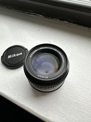 Nikon Nikkor 50mm 1:1.4 AI-S lens - WORKING - Read before purchasing. There are a few specs of dust inside the lens. I...