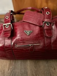 This exquisite red crocodile bag from Prada Milano is the perfect addition to any fashion lovers collection. Crafted...