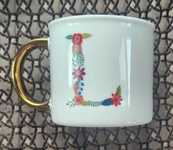This simply elegant mug can hold your beverage of choice in style! Made of porcelain and decorated with flowers forming...