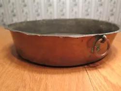 Not sure of the exact age of this pan, but it has certainly been around for. It has one copper ring on the outside; the...