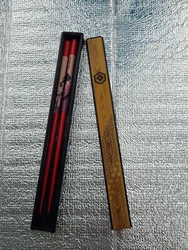 Up for auction is a pair of chopsticks in a case with a sliding top that were found at an estate sale.  They appear to...