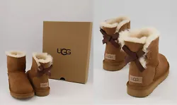 Mini Bailey Bow II (Model: 1016501) in Chestnut color. Treadlite by UGG™ outsole for comfort. Fixed satin bow along...