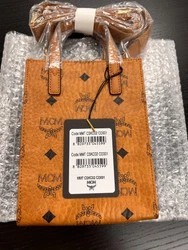 Visetos monogram coated canvas. MCM Aren Klassik Mini Top-Handle X-Mini Tote Bag. MCM logo plate. 31.5