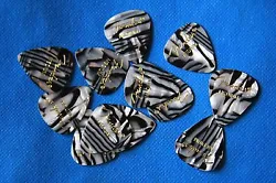 These are zebra striped. These are standard 351 size picks made of premium celluloid.