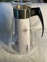 Used. No Lid!!Some paint loss. No chips or cracks. The screws are on tight. Tall 8.5”Vintage Atomic Star Burst Coffee...