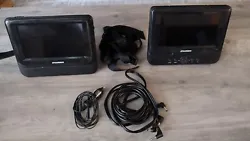 Sylvania Dual Portable DVD Player Black 2 Screens SDVD7750. This is a used dual screen DVD player that comes with seat...
