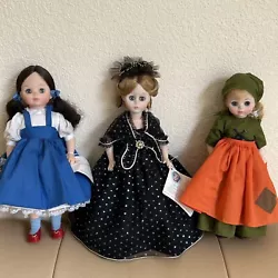 This lot includes three vintage Madame Alexander dolls, each measuring 14, 13, and 12 inches tall. They are girl dolls...