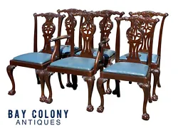 The set consists of 1 arm chair and 5 side chairs with blue leather seats. The chairs have pierced splats and are...
