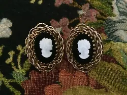 I am not sure if the stone is black onyx or black glass, but it is faceted on the edges. They are about 1 1/8” in...
