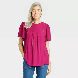 •Short-sleeve eyelet embroidered top •Soft and lightweight fabric •Back slit with button closure •Solid color ...