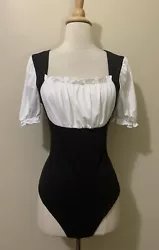 Womens NEW!! Size Med & large. Black & white ruched colorblock puff sleeve bodysuit. Absolutely one of the bestttt...