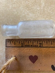 It has printing on 3 sides: Dr. Kings New Life Pills, Chicago, USA, and H E Bucklen & Co.