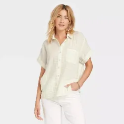 Spruce up your warm-weather casualwear with the Short Sleeve Button-Down Shirt from Universal Thread™. Material: 99%...