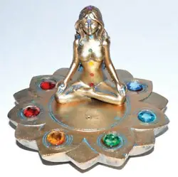 Empower the Seven chakras while burning on this lotus flower based burner. Chakra symbols represented by their...