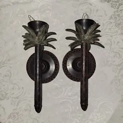 Add a touch of tropical charm to any room with this pair of brass palm tree wall candle sconces. The colonial brown...
