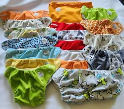 Huge bundle of pre-loved cloth pocket style diapers with bonus drawstring bag. Diapers include Manufacturer website...