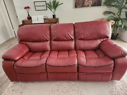 Red leather sofa in good condition. Only obvious signs of use are scuffs on the back as seen in last 2 pictures....
