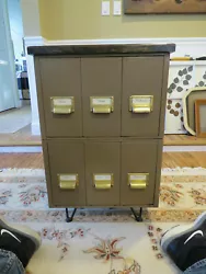 A beautiful dark stained wooden top was added making this piece a realhead turner. The drawers open smoothly. Iveseen...