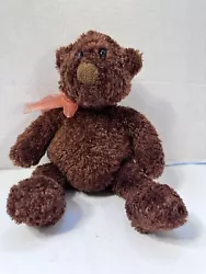 This is an adorable rounded belly brown bear from Back to Basics. He’s dressed up with an orange bow and is 13”...