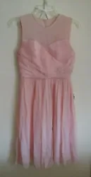 A beautiful dress in excellent, gently worn condition. The top part is slightly sheer. Zippers down the back.