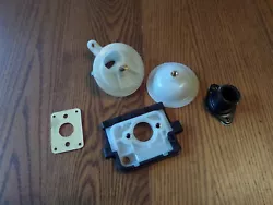 Echo CS 400. Manifold and Spare Plastic Parts. These parts were pulled from a new.