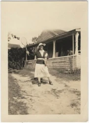 There is no actual tennis court in sight, but that never stopped Dora. 2.5”x3.5”. Minor soil, light wear.