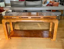 Stunning chinoiserie chow leg Ming style sofa table with two smoked beveled glass inserts and burl wood inlays. They...