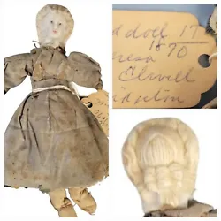 This little treasure is an antique doll made with a broken doll head and a handmade cloth body. The head is stuffed...