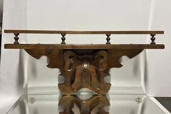 There is 1 shelf with a plate groove and what a very nice folk art bow design. 5 1/2