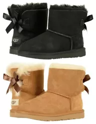 Treadlite by UGG outsole for comfort. Woven heel label with UGG logo. Fixed satin bow along back shaft. Built to move...