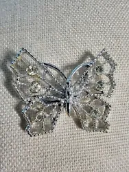 Rhinestone Silver Tone Butterfly Brooch. Silver tone with 6 accent rhinestones. No obvious marking but there is...