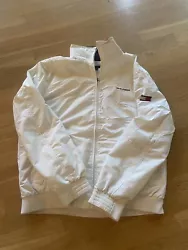 Tommy Hilfiger White Jacket Size Large. Good condition, see pictures. Small mark on Hilfiger logo on the sleeve....