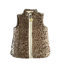 One side is a cream colored quilted fabric; the other side is a faux fur with animal print.