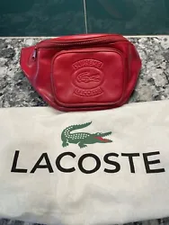 Supreme x Lacoste Waist Bag Red. In good condition and minor scuffs as seen in pic 7 and 8Second ownerAuthentic but no...