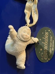 Snowbabies Department 56 Mini Ornament Hold that Pose. Ornament size about 2 inches by 2.5 inchesOrnament is pre-owned...
